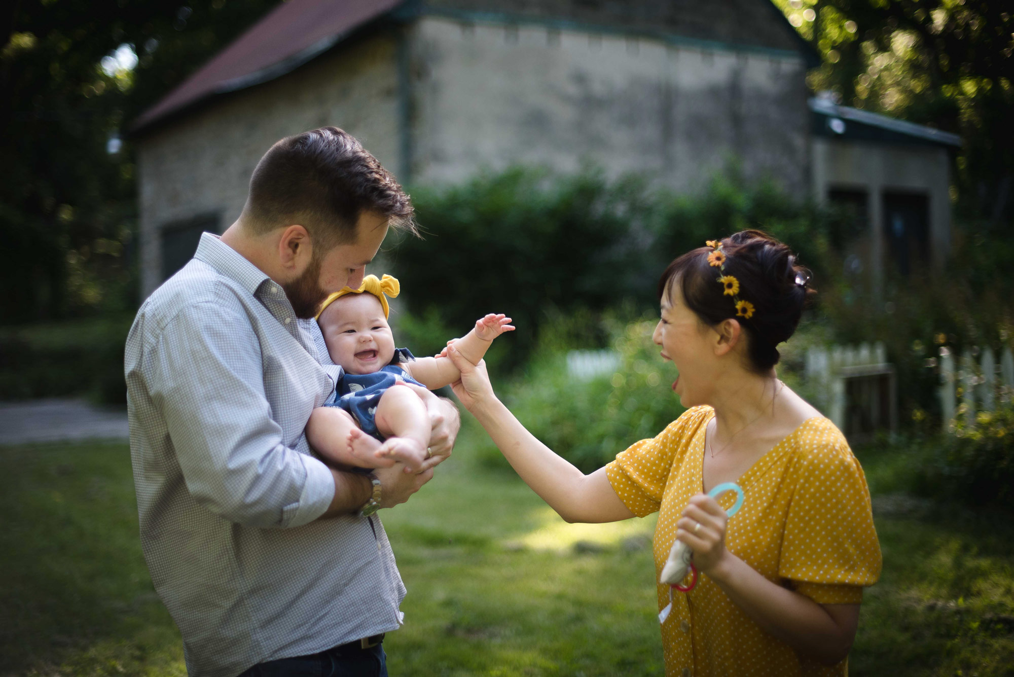 Family of three lovingly interacting