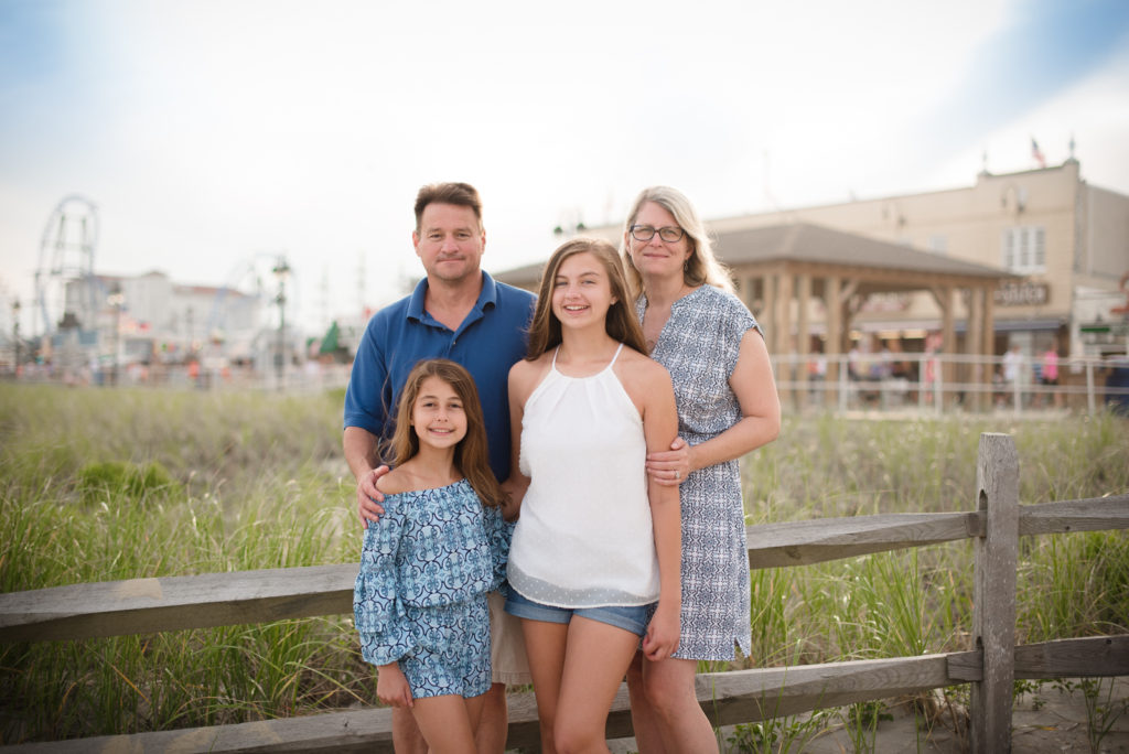 Mom and Dad with two daughters at beach