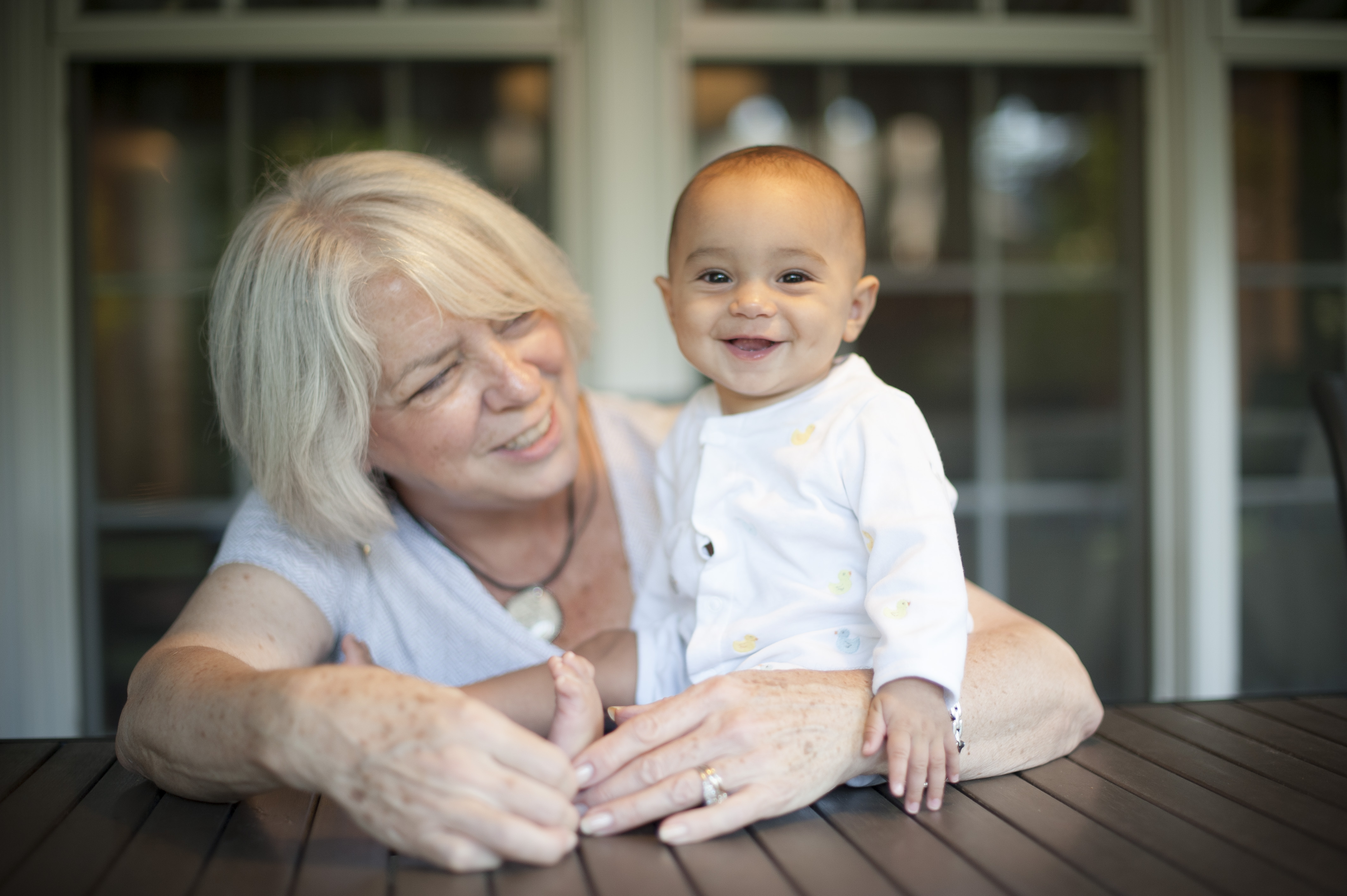 Grandmother and granddaughter smiling