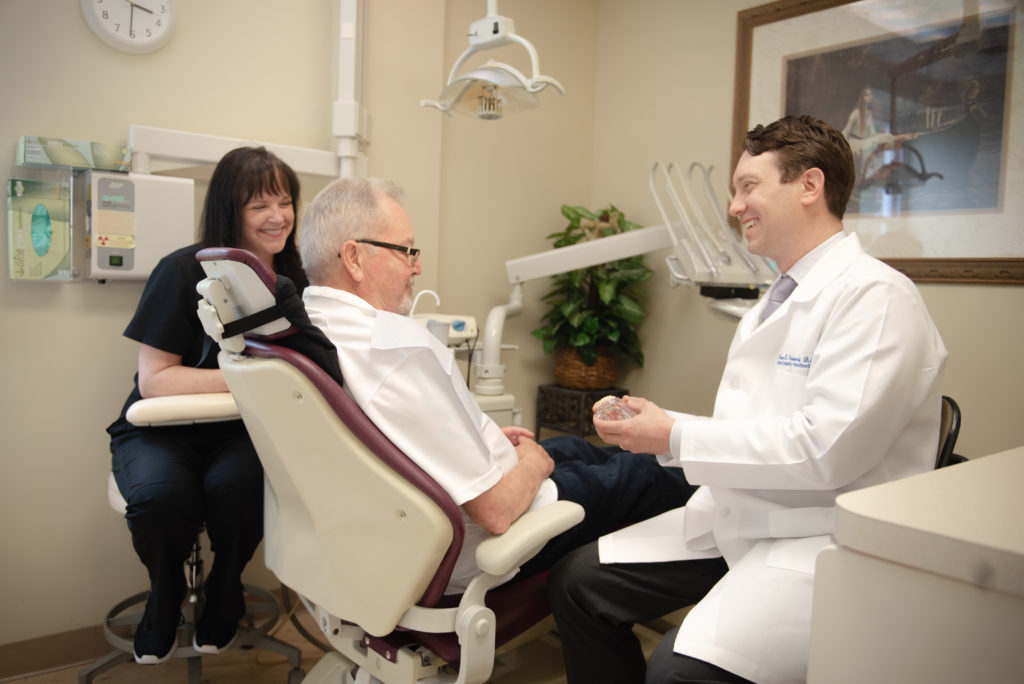 Periodontist with patient