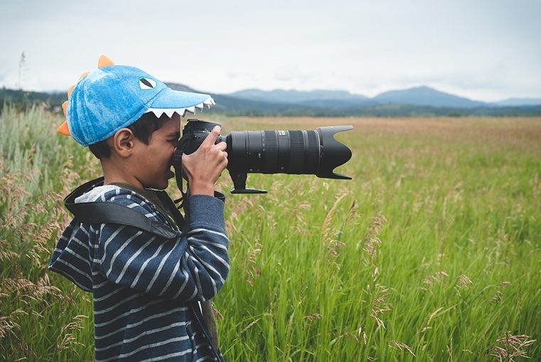 Boy holding camera