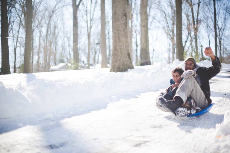 Father and son sledding