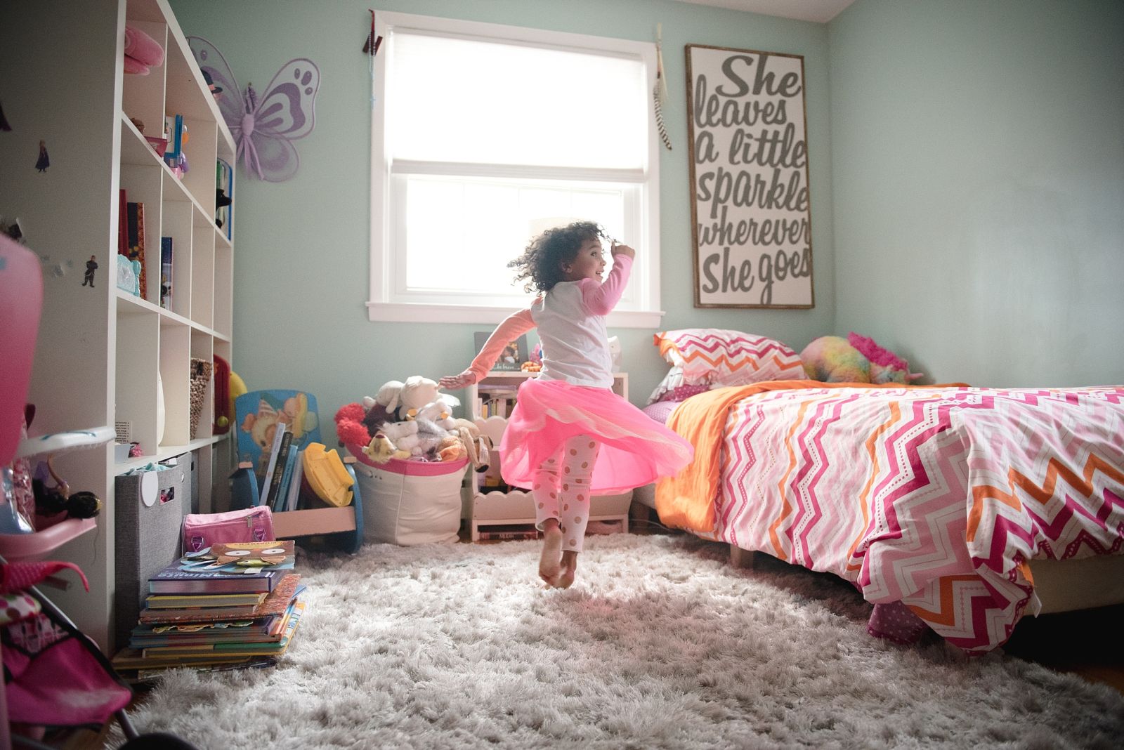 Little girl playing in her room