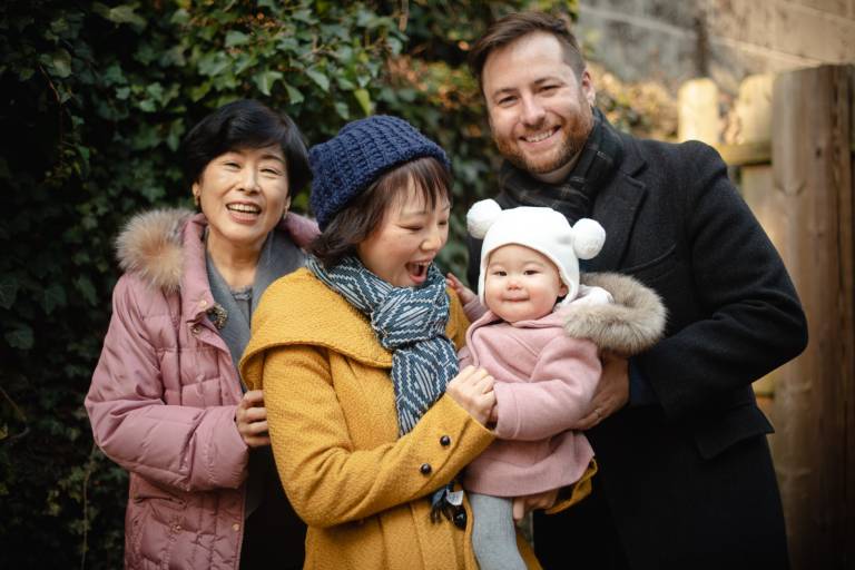 Mom, Dad, Grandmom, with baby girl