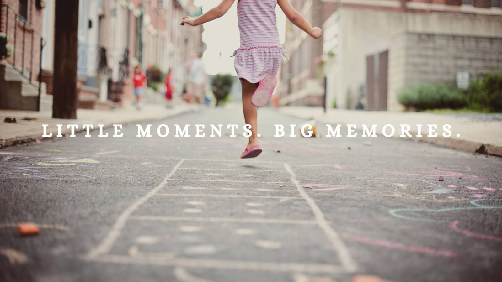 Little girl playing hopscotch on Philadelphia Street