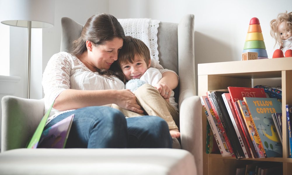 Mother Son Snuggling in Arm Chair