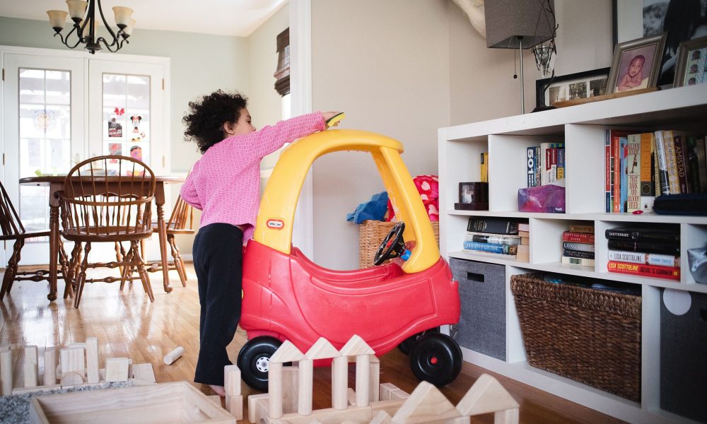 Toddler cleaning car